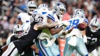 Las Vegas Raiders defensive end Maxx Crosby (98) forces a fumble by Dallas Cowboys quarterback Dak Prescott (4) during the first half at Allegiant Stadium. Mandatory Credit: Stephen R. Sylvanie-Imagn Images