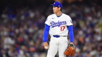 Los Angeles Dodgers two-way player Shohei Ohtani (17) looks out at the scoreboard during a challenge of a ball/strike call in the third inning against the Cleveland Guardians at Dodger Stadium.