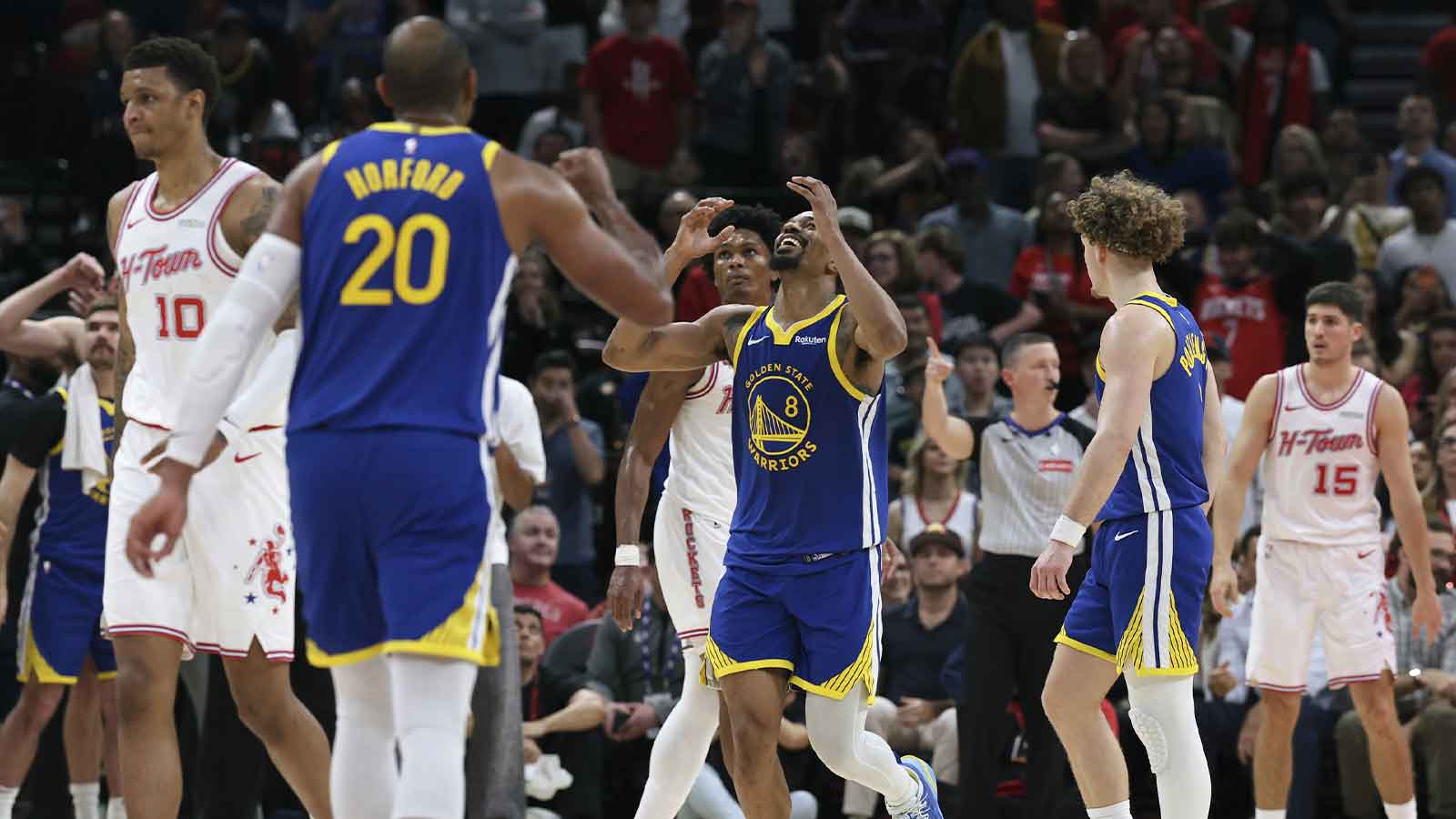 Golden State Warriors guard De'anthony Melton (8) celebrates after scoring a basket during overtime against the Houston Rockets at Toyota Center.