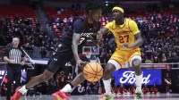 Utah Utes guard Don McHenry (3) drives against Iowa State Cyclones guard Killyan Toure (27) during the second half at Jon M. Huntsman Center.