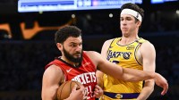 Houston Rockets forward David Roddy (21) drives the ball against Los Angeles Lakers guard Austin Reaves (15) during the second half at Crypto.com Arena.