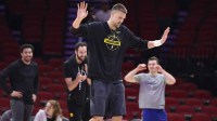 Golden State Warriors center Kristaps Porzingis (7) reacts while warming up before the game against the Houston Rockets at Toyota Center.