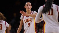 USC Trojans guard Jazzy Davidson (9) greets guard Kennedy Smith (11) during a time out in the second half against the Iowa Hawkeyes at Galen Center.