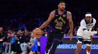 Los Angeles Lakers guard Marcus Smart (36) moves the ball ahead of Minnesota Timberwolves forward Jaden McDaniels (3) during the first half at Crypto.com Arena.