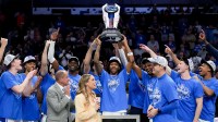 Duke Blue Devils guard Isaiah Evans (3) hoists the trophy after defeating the Virginia Cavaliers in the men's ACC Conference Tournament Championship at Spectrum Center.