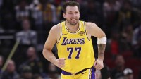 Los Angeles Lakers guard Luka Doncic (77) reacts after scoring a basket during the first quarter against the Houston Rockets at Toyota Center.
