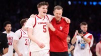 Nebraska Cornhuskers forward Braden Frager (5) and head coach Fred Hoiberg celebrate after defeating the Troy Trojans during a first round game of the men's 2026 NCAA Tournament at Paycom Center.