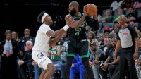 Boston Celtics guard Jaylen Brown (7) handles the ball as Memphis Grizzlies forward Olivier-Maxence Prosper (18) defends during the fourth quarter at FedExForum.