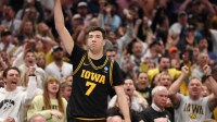 Iowa Hawkeyes forward Alvaro Folgueiras (7) makes a go-ahead three-point basket against the Florida Gators late in the second half during a second round game of the men's 2026 NCAA Tournament at Benchmark International Arena.