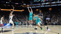 Charlotte Hornets guard Kon Knueppel (7) shoots in front of San Antonio Spurs forward Victor Wembanyama (1) in the first half at Frost Bank Center.