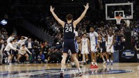 UConn Huskies guard Braylon Mullins (24) celebrates after making the game-winning three-point basket against the Duke Blue Devils in the second half during an Elite Eight game of the East Regional of the men's 2026 NCAA Tournament at Capital One Arena.