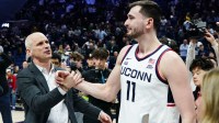 UConn Huskies forward Alex Karaban (11) has a moment on the court with head coach Dan Hurley after defeating the Seton Hall Pirates at Harry A. Gampel Pavilion.