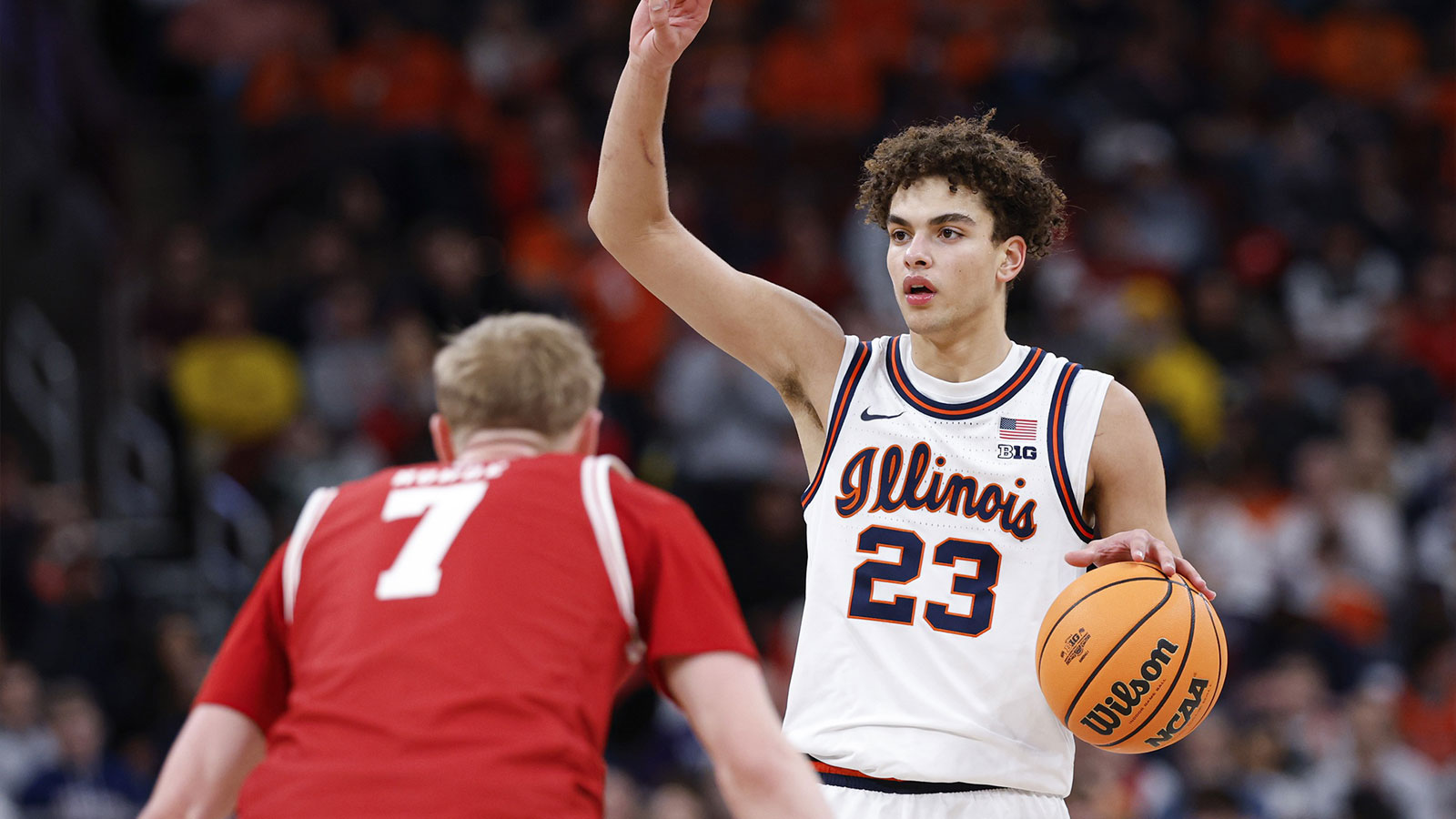 Illinois Fighting Illini guard Keaton Wagler (23) brings the ball up court against Wisconsin Badgers guard Andrew Rohde (7) during the second half at United Center