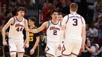 Illinois Fighting Illini guard Andrej Stojakovic (2) and forward Ben Humrichous (3) react in the second half against the Iowa Hawkeyes during an Elite Eight game of the South Regional of the men's 2026 NCAA Tournament at Toyota Center.