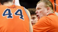 Illinois Fighting Illini head coach Brad Underwood leads a team huddle.