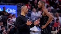Houston Rockets head coach Ime Udoka talks with Houston Rockets forward Kevin Durant (7) during the game against the New Orleans Pelicans at Toyota Center.