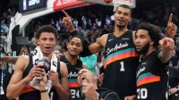San Antonio Spurs forward Victor Wembanyama (1) reacts with teammates forwards Carter Bryant (11) and Julian Champagnie (30) and guard Devin Vassell (24) after securing a comeback victory over the Los Angeles Clippers at Frost Bank Center. Mandatory Credit: Scott Wachter-Imagn Images
