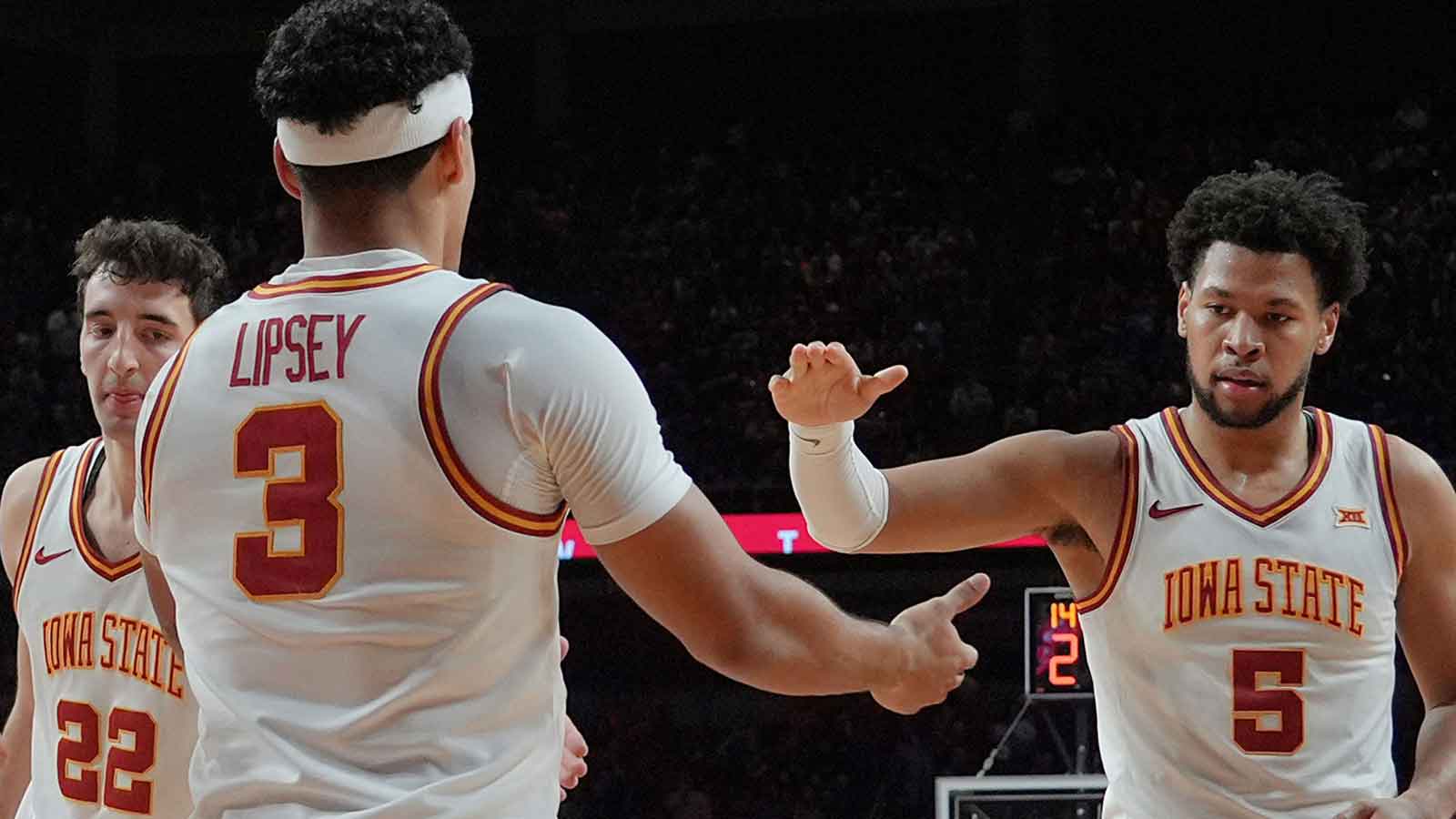 Iowa State Cyclones guard Tamin Lipsey (3)celebrates with forward Joshua Jefferson (5) and forward Milan Momcilovic (22) after a three-point play during the second half on Jan. 2, 2026, at Hilton Coliseum in Ames, Iowa.