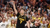 Iowa Hawkeyes forward Alvaro Folgueiras (7) makes a go-ahead three-point basket against the Florida Gators late in the second half during a second round game of the men's 2026 NCAA Tournament at Benchmark International Arena.