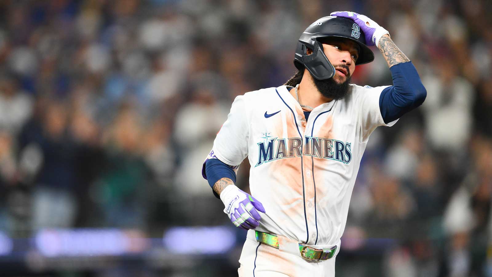 Seattle Mariners shortstop J.P. Crawford (3) runs to first base after hitting a single during the fifth inning against the Toronto Blue Jays during game three of the ALCS round for the 2025 MLB playoffs at T-Mobile Park.