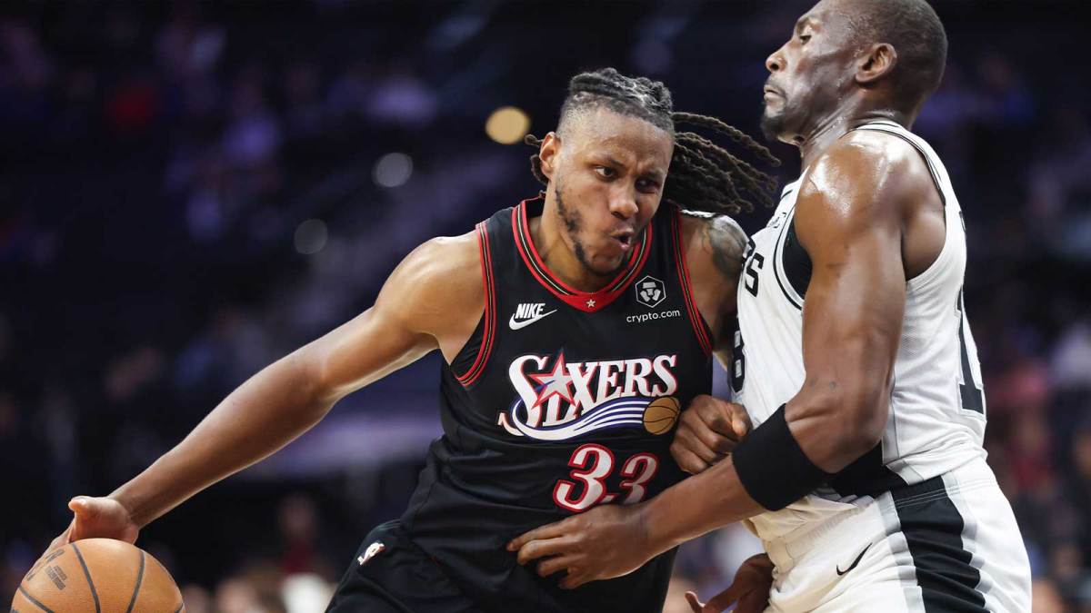 Philadelphia 76ers forward Jabari Walker (33) drives against San Antonio Spurs center Bismack Biyombo (18) during the fourth quarter at Xfinity Mobile Arena.