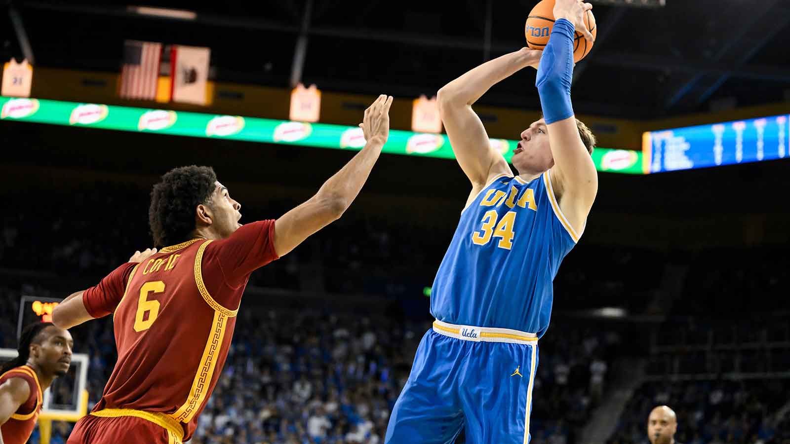 UCLA Bruins forward Tyler Bilodeau (34) shoots over Southern California Trojans forward Jacob Cofie (6) during the second half at Pauley Pavilion presented by Wescom Financial.