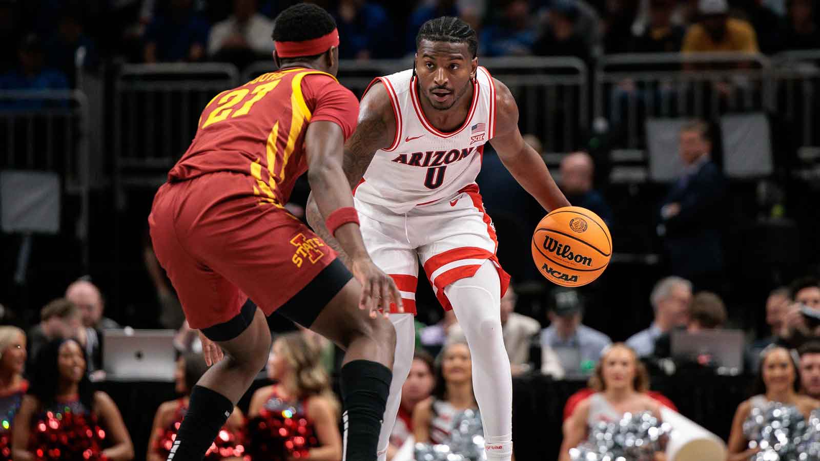 Arizona Wildcats guard Jaden Bradley (0) brings the ball up court around Iowa State Cyclones guard Killyan Toure (27) during the first half at T-Mobile Center.
