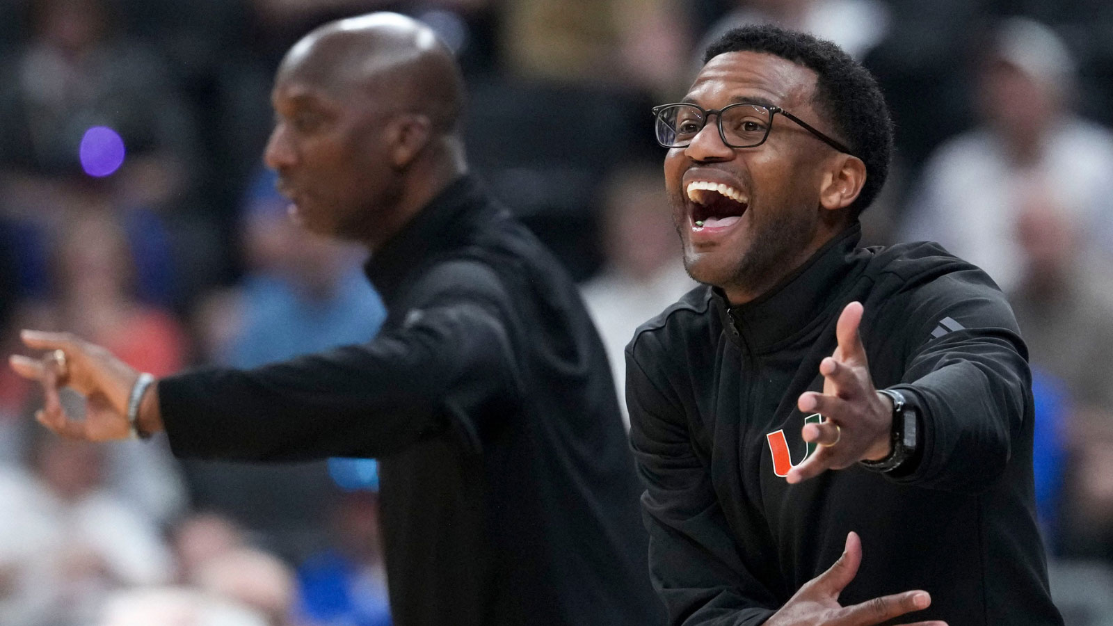 Miami Hurricanes head coach Jai Lucas yells to his team during a NCAA Tournament second round game against the Purdue Boilermakers on Sunday, March 22, 2026, at Enterprise Center in St. Louis. Purdue defeated Miami 79-69.