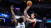 Miami Heat forward Jaime Jaquez Jr. (11) shoots the ball while Indiana Pacers guard Kobe Brown (24) defends in the second half at Gainbridge Fieldhouse.