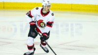 Ottawa Senators defenseman Jake Sanderson (85) skates with the puck against the Calgary Flames during the first period at Scotiabank Saddledome.