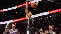 Atlanta Hawks forward Jalen Johnson (1) dunks against the Philadelphia 76ers during the second half at State Farm Arena.