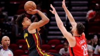 Atlanta Hawks forward Jalen Johnson (1) shoots against Houston Rockets center Alperen Sengun (28) during the first quarter at Toyota Center.