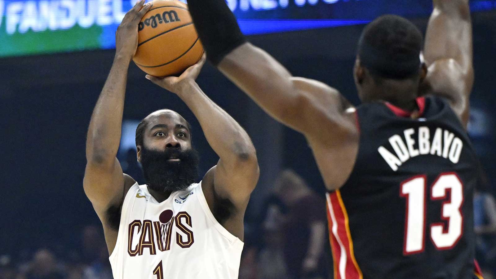 Cleveland Cavaliers guard James Harden (1) shoots beside Miami Heat center Bam Adebayo (13) in the third quarter at Rocket Arena. 
