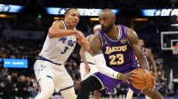 Los Angeles Lakers forward LeBron James (23) drives to the basket past Orlando Magic guard Desmond Bane (3) in the second quarter at Kia Center.