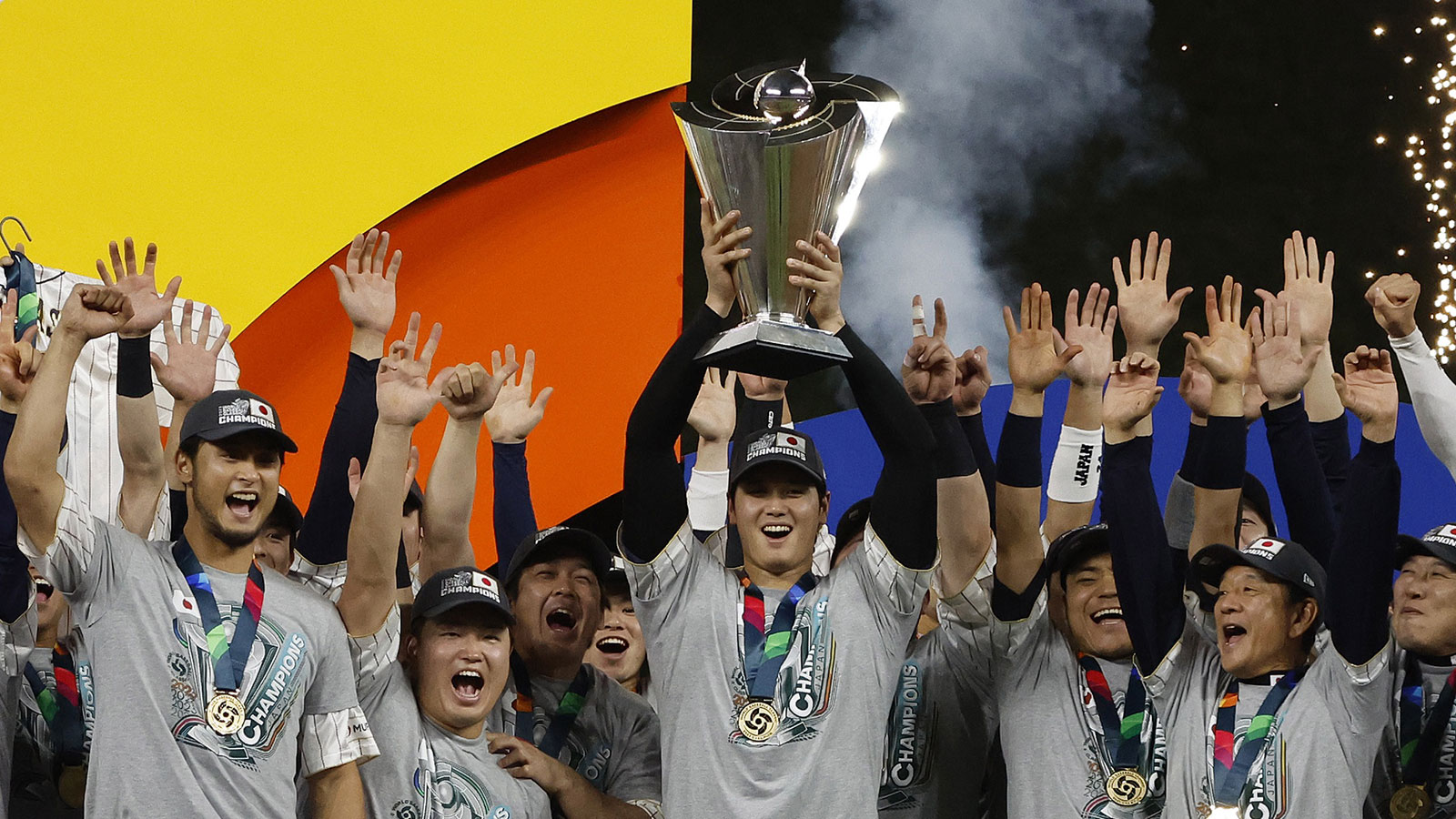 Japan designated hitter and closing pitcher Shohei Ohtani (16) and team Japan celebrate with the World Baseball Classic trophy after defeating the USA in the World Baseball Classic at LoanDepot Park. 