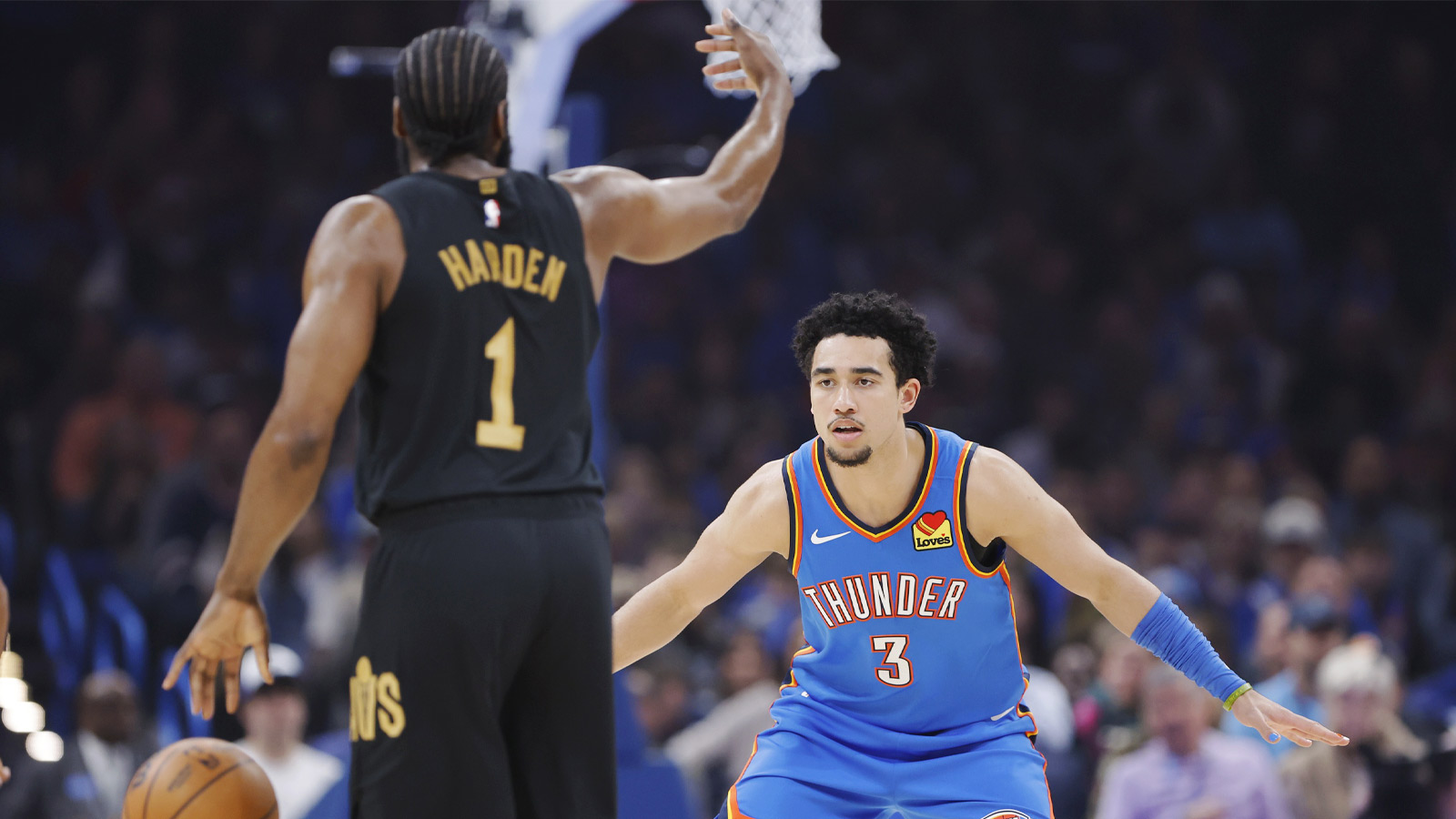 Oklahoma City Thunder guard Jared McCain (3) defends Cleveland Cavaliers guard James Harden (1) during the first half at Paycom Center.