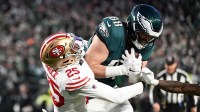 Philadelphia Eagles tight end Dallas Goedert (88) scores a touchdown defended by San Francisco 49ers safety Jason Pinnock (25) during the first quarter in an NFC Wild Card Round game at Lincoln Financial Field.