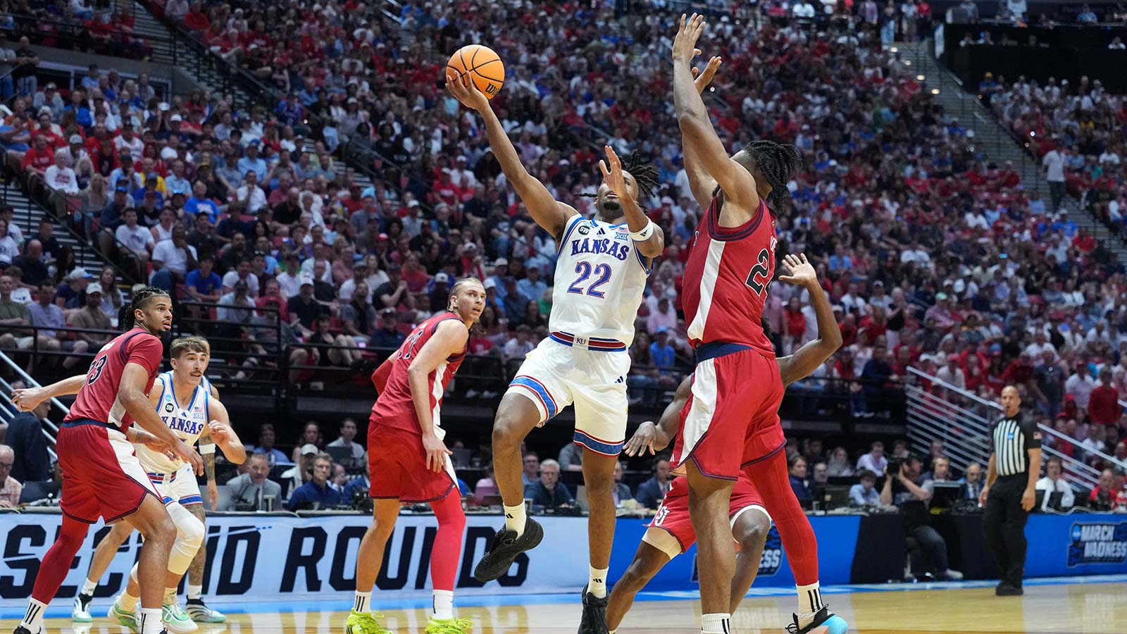 Kansas Jayhawks guard Darryn Peterson (22) shoots against St. John's Red Storm forward Zuby Ejiofor (24) in the second half during a second round game of the men's 2026 NCAA Tournament at Viejas Arena.