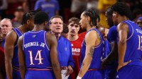 Kansas Jayhawks head coach Bill Self (center) in the huddle with his players against the Arizona State Sun Devils in the first half at Desert Financial Arena.