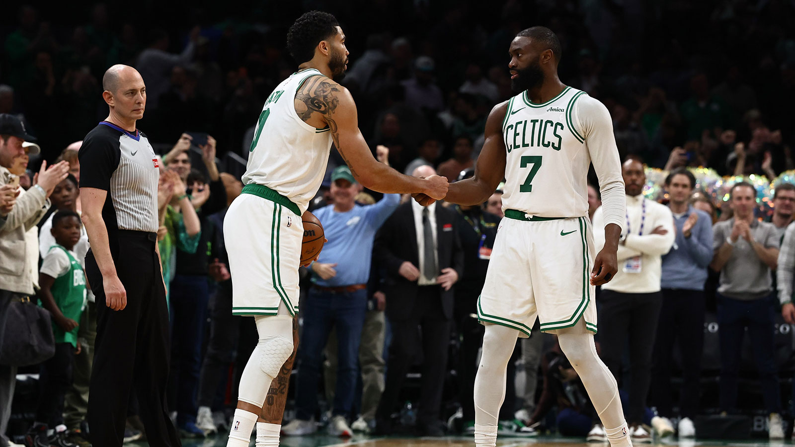 Boston Celtics guard Jaylen Brown (7) and forward Jayson Tatum (0) congratulate each other in the final seconds of the fourth quarter of their win over the Oklahoma City Thunder at TD Garden.