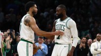 Boston Celtics guard Jaylen Brown (7) and forward Jayson Tatum (0) congratulate each other in the final seconds of the fourth quarter of their win over the Oklahoma City Thunder at TD Garden.