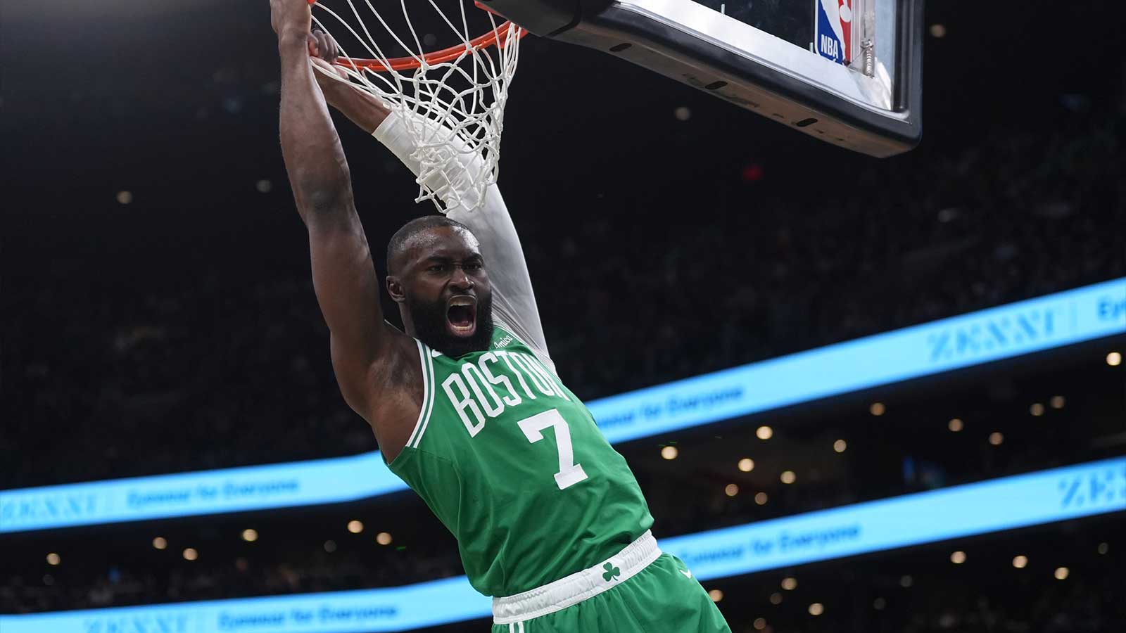 Boston Celtics guard Jaylen Brown (7) makes the basket against the Golden State Warriors in the first quarter at TD Garden.