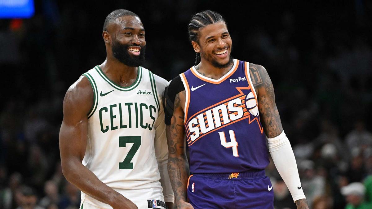 Phoenix Suns guard Jalen Green (4) and Boston Celtics guard Jaylen Brown (7) talk after a game at the TD Garden.