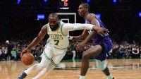 Boston Celtics guard Jaylen Brown (7) controls the ball while Charlotte Hornets forward Moussa Diabate (14) defends during the first half at TD Garden.