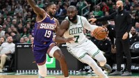 Boston Celtics guard Jaylen Brown (7) drives to the basket against the Phoenix Suns during the second half at the TD Garden.