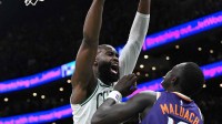 Boston Celtics guard Jaylen Brown (7) collides with Phoenix Suns center Khaman Maluach (10) during the second half at the TD Garden.