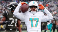 Miami Dolphins wide receiver Jaylen Waddle (17) reacts after making a catch for a touchdown against the New York Jets during the first half at MetLife Stadium.