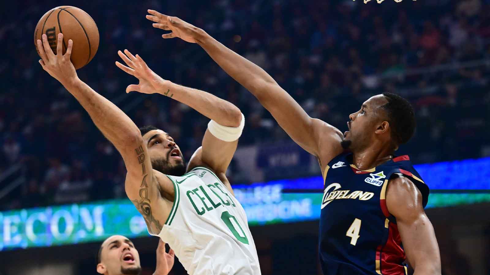Boston Celtics forward Jayson Tatum (0) drives to the basket against Cleveland Cavaliers center Evan Mobley (4) during the first half at Rocket Arena.