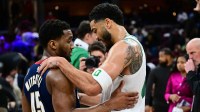Cleveland Cavaliers guard Donovan Mitchell (45) talks to Boston Celtics forward Jayson Tatum (0) after the game at Rocket Arena.
