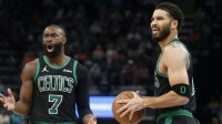 Boston Celtics guard Jaylen Brown (7) and forward Jayson Tatum (0) react during the third quarter against the Memphis Grizzlies at FedExForum.